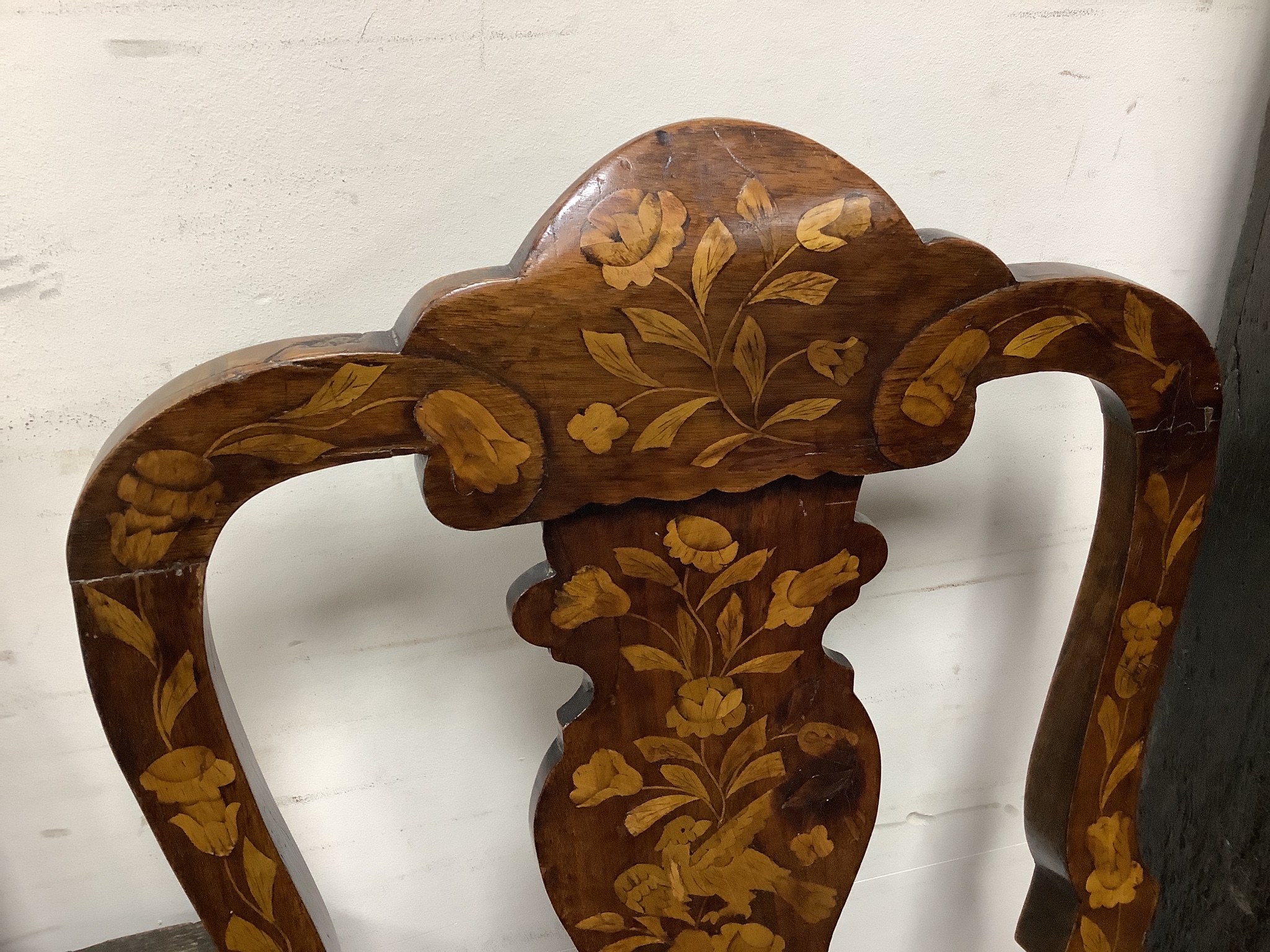 A pair of late 18th century Dutch floral marquetry walnut high back dining chairs